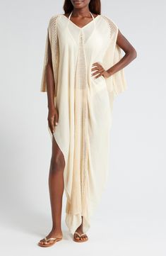 Add a little drama to your poolside look with a flowy crepe caftan aired out with open-stitch trim V-neck Elbow-length sleeves 50% acrylic, 50% viscose Hand wash, dry flat Imported V-neck Unlined Maxi Dress For Beach, Oversized V-neck Spring Cover-up, Unlined V-neck Cover-up For Vacation, Summer V-neck Unlined Cover-up, Flowy V-neck Tunic For Beach Cover-up, Oversized V-neck Tunic For Beach Cover-up, Oversized V-neck Beachwear Cover-up, V-neck Maxi Dress For Beach Cover-up, V-neck Maxi Dress Beach Cover-up