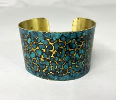 These unique, hand-formed copper and brass cuff bracelets with vibrant patinas create stunning accents to your personal style. Dress up or down- either way you'll be wearing an adornment that will turn heads, start conversations, and delight the eye of the beholder. Hammered Brass cuff with a beautiful bright blue cupric nitrate patina. Please note that patina colors will look different depending on the screen/device you view them on. This is a medium size cuff, see measurements below. Cuffs hav Artisan Blue Bangle Cuff Bracelet, Artisan Blue Cuff Bangle Bracelet, Artisan Blue Cuff Bracelet, Artisan Handmade Blue Bangle, Adjustable Blue Cuff Bracelet With Patina, Adjustable Blue Patina Cuff Bracelet, Blue Cuff Bracelet With Patina As A Gift, Blue Cuff Bracelet With Patina For Gifts, Blue Patina Cuff Bracelet As Gift