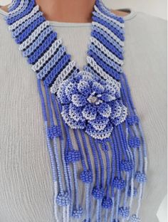 This is a Huichol Style Beadwork with the length of 17.71 inches (45 cm)  Diameter of the flower is 2.36 inches (6 cms) Bright beautiful decoration in the style of Wichol. The decoration is suitable for many outfits and holidays, a great gift for mom, sister or daughter. Please note that due to lighting effects, monitor's brightness, contrast and other settings, there might be some slight differences in the color tone/shade of the web site's photo and the actual item. Blue Flower Necklace With Colorful Round Beads, Traditional Blue Flower Jewelry, Bohemian Blue Flower Necklace, Handmade Blue Flower Beaded Necklaces, Flower Shaped Beaded Necklaces With Large Beads For Gifts, Blue Flower-shaped Beaded Necklaces With Colorful Beads, Flower-shaped Beaded Necklaces For Gift, Flower-shaped Beaded Necklace With Large Beads As Gift, Flower Shaped Beaded Necklace With Large Beads For Gift