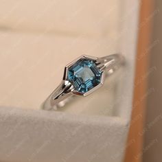 This ring features a 6*6mm asscher cut london blue topaz and sterling silver finished with rhodium. Customization is available. It is made by hand, and it will take about 7 days to finish the ring after your payment is completed. Any question, just let me know. :) My shop homepage: https://www.etsy.com/shop/LuoJewelry?ref=l2-shopheader-name Luo Jewelry, Cushion Cut Halo Ring, Emerald Cut Solitaire Ring, Wholesale Jewelry Supplies, Mystic Topaz Ring, Ring Emerald Cut, Pear Cut Engagement Rings, Ring Rosegold, Birthstone Rings