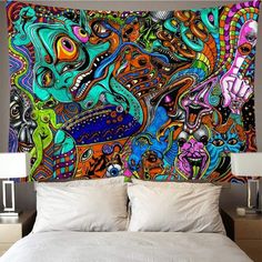 a colorful wall hanging over a bed in a bedroom