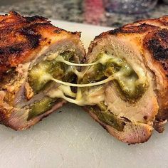 a cut in half sandwich sitting on top of a cutting board