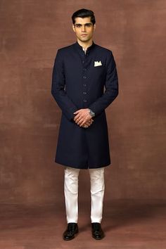 Navy achkan accentuated with piping on the cuff on textured fabric base. - Aza Fashions Plain Sherwani For Men, Blue Achkan For Men, Classic Fitted Kurta For Workwear, Traditional Fitted Kurta With Button Cuffs, Navy Blue Sherwani, Achkan For Men, Raghavendra Rathore, Blue Sherwani, Wedding Kurta