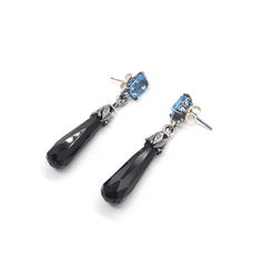 These one of a kind earrings feature two stunning blue 6x8mm topaz with two black onyx briolette drops on silver embellished earrings. These are one of a kind and will not be made again Dimensions 44mm long x 8mm wide on a 11mm long earring post Sterling Silver Drop Earrings With Gemstone Accents, Gemstone Dangle Earrings For Evening, Blue Topaz Faceted Dangle Earrings, Silver Briolette Earrings For Evening, Faceted Blue Topaz Dangle Earrings, Faceted Blue Topaz Drop Earrings, Faceted Drop Earrings For Evening, Blue Topaz Gemstone Drop Earrings, Blue Topaz Drop Earrings With Matching Set