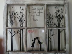 an old window with two people kissing in front of trees and the words have found me among my soul