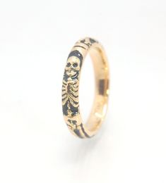 This is the middle width of my Memento Mori skeleton rings at 4mm wide and cast in 14k rich yellow gold. The Skeleton is flanked by crossed bones on one side and an hourglass on the other.14k Gold and EnamelMade to Order. Usually ships in 5-10 days.This ring looks great as part of a stack, as a wedding band, a right-hand ring, or a promise ring, and all by its damn self, thank you very much. And as always, my rings are Unisex. Y’all wear what you want!I made these Memento Mori rings for my older Momento Mori Ring, Gold Skull Ring, Skeleton Rings, Memento Mori Jewelry, Memento Mori Ring, Skeleton Ring, Material Things, Private Wedding, Gold Skull