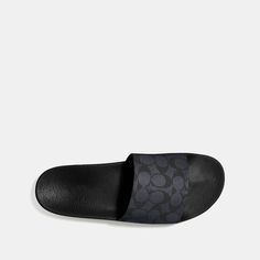 This sporty slide is crafted in our Signature canvas. A summer essential the rubber sole offers great traction on city streets and poolside. | Coach Slide Sandal Size 13 - Charcoal Signature Summer Slip-on Sport Sandals For Streetwear, Casual Poolside Slip-on Slides, Sporty Slip-resistant Slip-on Flip Flops, Textured Footbed Slip-on Slides For Streetwear, Cushioned Slip-on Flat Slides, Poolside Slip-on Sandals With Textured Footbed, Adjustable Casual Sport Sandals, Summer Sports Slide Sandals, Slip-resistant Slide Sandals For Spring