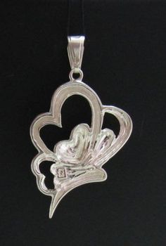 Sterling silver pendant - PE000739. Stamped 925. Approximate weight 4.2 grams. Dimensions 3.2x2.1cm (1.28x0.84 inches).All our jewels are made from solid sterling silver 925/1000 and are carefully crafted by hand in our family workshop.We dispatch your orders in 5 working days, worldwide and the postage is $5. We ship registered priority mail. Please allow 5-7 working days for delivery in Europe and 10-15 working days outside Europe.For any questions – please do not hesitate to contact me! Nickel-free Silver Heart Cut Jewelry, Sterling Silver Pendant Jewelry With Hallmark, Silver Double Heart Jewelry With Hallmark, Silver Heart Cut 925 Stamped Jewelry, Silver Heart Cut Jewelry Stamped 925, Sterling Silver Open Heart Jewelry, White Gold Heart Pendant Stamped 925, Silver Heart Pendant Jewelry With Hallmark, Silver Heart Jewelry With Large Pendant