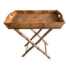 a wooden tray with two crossed legs