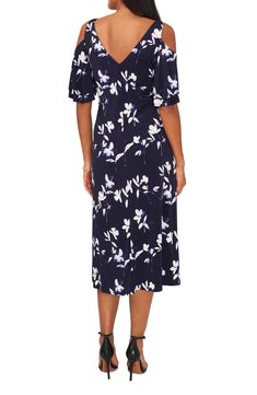 Blue-hued blooms delight on this soirée-ready frock styled with fluttering cold-shoulder sleeve and a flowy hem. V-neck Short sleeves 95% polyester, 5% spandex Machine wash, tumble dry Made in the USA Point of View Elegant Floral Dress With Flutter Sleeves For Garden Party, Elegant Short Sleeve Flowy Floral Dress, Elegant Flowy Short Sleeve Floral Dress, Elegant Flowy Floral Dress With Short Sleeves, Blue Flutter Sleeve Midi Dress For Evening, Summer Dresses With Flowy, Flattering Silhouette, Elegant Summer Floral Fit And Flare Dress, Elegant Floral Fit And Flare Dress For Summer, Elegant Fit And Flare Floral Dress For Summer