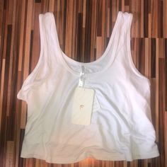 Nwt Fabletics White Flowy Tank Top White Activewear With Built-in Bra For Everyday, White Athleisure Top With Built-in Bra, White Sporty Tank Top For Loungewear, White Seamless Summer Activewear, White Sleeveless Activewear For Loungewear, White Medium Support Tops For Loungewear, White Tops For Loungewear With Medium Support, White Sleeveless Loungewear Activewear, White Medium Support Top For Loungewear