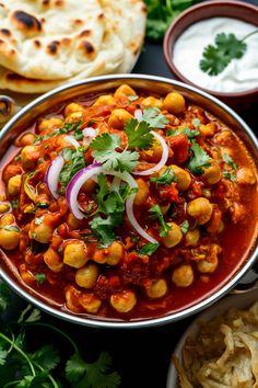 Chickpea curry garnished with cilantro and red onion, served with naan and yogurt on the side. Japanese Sukiyaki Recipe, Chole Recipe, Punjabi Cuisine, Jeera Rice, Easy Indian Recipes, Using A Pressure Cooker, Taste Made