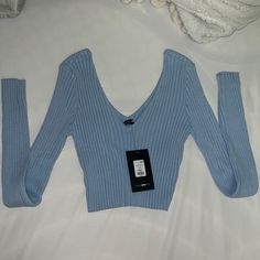 Ribbed Long Sleeve V Neck Sweater Light Blue Sz Large Nwt Fashion Nova Light Blue Knit V-neck Top, Blue Ribbed Sweater For Spring, Trendy Cropped Blue Sweater, Fitted Blue Crop Top For Winter, Trendy Blue Ribbed Sweater, Light Blue Fitted V-neck Sweater, Light Blue V-neck Winter Top, Fitted Light Blue V-neck Sweater, Fitted V-neck Light Blue Sweater