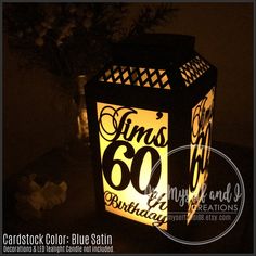 a lit up lantern with the number sixty on it