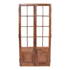 an old wooden double door with glass panels