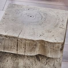 a concrete box sitting on top of a wooden floor