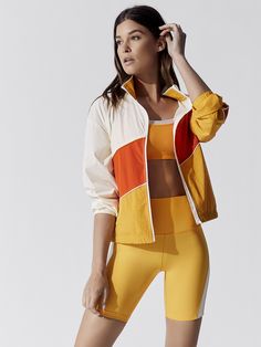 Bright Sporty Outfits, Orange Athleisure, Activewear Editorial, Stretch Clothes, Nike Sportswear Women, Model Pose, Yellow Jacket, Activewear Brands, Activewear Fashion