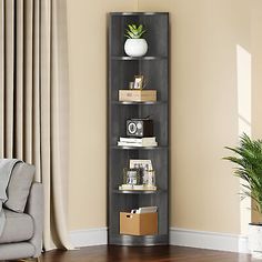 a corner bookcase in the corner of a living room