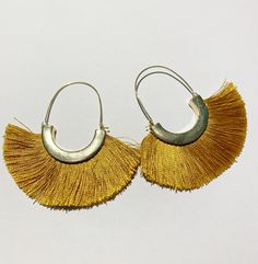 Super chic and fun silk thread fringe tassel earrings.  The matte vintage color gold earrings come in a blush/beige color and also a vibrant marigold color. These are the statement earrings for the fall 2020 season - they are a soft silk fringe so they are lightweight and comfortable to wear with any outfit. Trendy Gold Fringe Earrings, Trendy Gold Tassel Earrings With Fringe, Adjustable Gold Tassel Earrings For Party, Gold Bohemian Tassel Earrings For Festive Occasions, Yellow Fringe Jewelry For Party, Elegant Gold Tassel Earrings For Summer, Summer Tassel Dangle Earrings, Summer Tassel Dangle Earrings With Latkans, Yellow Fringe Tassel Earrings