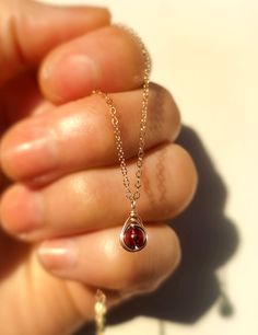 Petite, dainty and delicate. This Tiny Garnet Pendant Necklace is perfect for those who like discreet jewelry and minimalist fans. The pendant is delicately handmade with a wire-wrapping technique on a 4mm garnet gemstone bead.• Pendant size: 1 x 0.5 cm• Please note that the images are zoomed in for details and the items may appear larger in photographs. Kindly take note of the dimension provided.• All metal parts are 14k gold filled, rose gold filled, or sterling silver.• Garnet used is a natur Garnet Necklace Silver, Handmade Pendant Necklace, Mini Collection, Dainty Pendant, Garnet Pendant, Garnet Necklace, Bead Pendant, Garnet Jewelry, Matching Jewelry