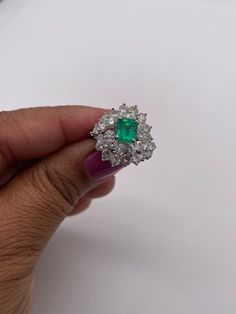 Stunningly gorgeous, Emerald & Diamond Ring set in Platinum. Handmade. Beautiful quality piece of jewelry. Approximately 2.20 ct. in Diamonds, Emerald is nice color & measures 1.15 ct. Diameter of ring is 19mm, size 6 but can be sized. Circa 1950's Luxury Gia Certified Emerald Gemstones, Elegant Green Gia Certified Gemstones, Fine Jewelry Diamond Cluster Gemstones, Elegant Gia Certified Emerald Cluster Ring, Gia Certified Elegant Emerald Gemstones, Elegant Gia Certified Emerald Gemstones, Luxury Emerald Gemstones With Prong Setting, Luxury Platinum Cluster Emerald Ring, Luxury Emerald Cluster Ring With Center Stone