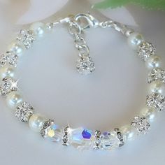 Bracelet is made with 6mm swarovski crystals, 8mm crystal, crystal beads, crystal spacers and white pearls Perfect for weddings Bridal Bracelet Pearl, Bracelet Craft, Bracelet Inspo, Crystal Anklet, White Pearl Bracelet, Bridal Ideas, Beading Jewelery, Swarovski Crystal Jewelry, Swarovski Crystal Bracelet