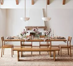 a dining room table set with wooden chairs