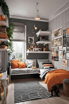 an orange and gray bedroom with lots of pictures on the wall, bedding and rugs