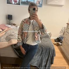 a woman taking a selfie in her bedroom