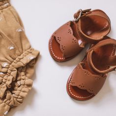 We’re in love with Adelisa & Co’s leather sandal Bella. With it’s delicate scallops and dainty vintage design, it has everything you’re looking for in a sandal for girls. Bella’s comfort and ability to compliment just about any outfit this summer will have you choosing it time and time again.  Available in baby, toddler, child and youth, & matching mom sizes. Vintage Closed-toe T-strap Sandals For Summer, Vintage Closed Toe T-strap Sandals For Summer, Vintage Open Toe T-strap Sandals For Summer, Vintage T-strap Sandals For Summer, Vintage Brown Sandals For Summer, Vintage Leather Sandals For Spring, Spring Brown Open Toe Barefoot Sandals, Brown Open Toe Barefoot Sandals For Spring, Brown Barefoot Sandals For Spring