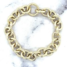 "➣ High quality 14K Yellow Gold 12mm Round Link Bracelet with Push Lock Clasp, 7.5\" Real Gold Bracelet, Chuncky Circle Link Bracelet, Women ➣ MATERIAL: 14K Yellow Gold  ➣ Closure: Push-in   ➣ Weights:  Bracelet - 7.5\" - 9 grams Necklace - 18\" - 19.6 grams  ◈ Please note that weights are approximate. ➣ If you need a specific length, please message us. Explore more gold bracelets. https://www.etsy.com/shop/MarinaMJewelry?ref=seller-platform-mcnav&search_query=gold+bracelet ➣ SHIPPING: ◈ We always offer domestic FREE SHIPPING via USPS first class (3-5 business days)  ◈ We ship internationally, shipping costs are shown at checkout.     Please be aware that the buyer is responsible for any international customs & duties. ◈ Orders shipped from NYC usually within 24-48 hours from receiving pay Gold Chunky Chain Bracelet, Yellow Gold Chain Link Bracelet With Polished Finish, Gold-plated Chunky Chain Bracelet With Oval Links, Gold-tone Solid Link Round Bracelet, Gold-tone Chain Link Bracelet With Solid Links, Yellow Gold-plated Link Bracelet, Real Gold Bracelet, Real Gold, Chain Link Bracelet