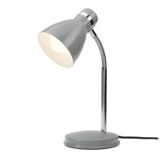 a lamp that is sitting on top of a white surface with a cord attached to it