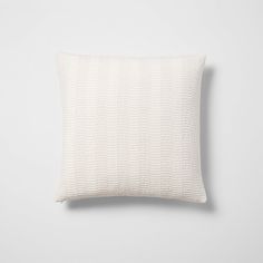 a white pillow on a gray background