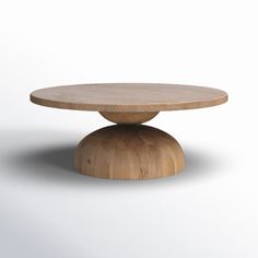 a round wooden table sitting on top of a white floor