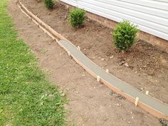 a garden path in front of a house