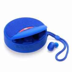 a blue portable speaker with earbuds on it's side next to a cord