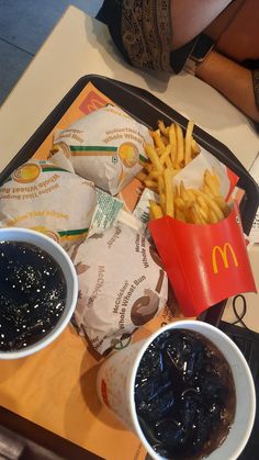 fries and ketchup sit on a tray at a fast food restaurant in the philippines