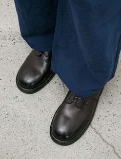 A five eyelet derby shoe cut from a buttery soft smooth leather with a soft shine in a rich chocolate brown. features a rounded toe with a straight foot profile lending a silhouette that draws the eye to the forefoot. waxed laces and a sturdy norwegian welt construction lend a rugged look that contrasts nicely with the formal feel of the foot profile. completed with a leather outsole and a leather heel with rubber slip pad; fully lined in natural tan leather. Classic Brown Leather Shoes With Lug Sole, Plain Toe Leather Shoes With Lug Sole For Derby, Brown Plain Toe Lace-up Shoes With Lug Sole, Brown Lace-up Shoes With Lug Sole, Derby Oxfords With Stitched Sole, Masculine Oxfords For Derby With Stitched Sole, Plain Toe Oxfords With Lug Sole, Masculine Plain Toe Oxfords For Derby, Masculine Style Lace-up Derby Shoes With Round Toe