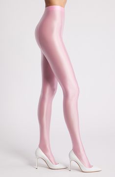 Sleek and shiny tights are made from lustrous stretch fabric to add a contemporary, fashion-forward look to any ensemble. Polyester/spandex Hand wash, dry flat Imported Shiny Sleek Stretch Leggings, Sleek Shiny Stretch Leggings, Sleek Fitted Shiny Leggings, Sleek Stretch Metallic Leggings, Sleek Metallic Stretch Leggings, Sleek Stretch Party Leggings, Sleek Stretch Leggings For Party, Sleek Fitted Shiny Bottoms, Fitted Pink Hosiery For Party