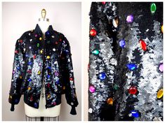 "This is an insanely GORGEOUS vintage piece of glam!! It's heavily embellished with black sequins and accented with multicolored jewels, all completely hand sewn. It's in PERFECT condition! This one is VERY well made!! Size SMALL Measurements: Bust - 40\" (while zipped) Waist - 26-36\" (unstretched and stretched) Length - 23\" Shoulders - 18\" Sleeves - 24\" Tag Size - 6 / Small (fits oversized) Size LARGE Measurements: Bust - 44\" (while zipped) Waist - 28-38\" (unstretched and stretched) Lengt Embellished Black Outerwear For Party Season, Black Embellished Outerwear For Party Season, Winter Party Outerwear With Rhinestones, Vintage Sequin Outerwear For Night Out, 80s Glam, Embroidered Roses, Evening Jackets, Beautiful Evening, Vintage Jacket