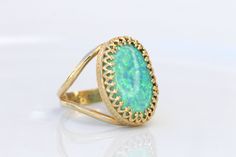 GREEN OPAL RING, Opal Gold Ring, Gemstone ring, October Birthstone, Opal Emerald lawn Gold Filled Ring, Fire Opal jewelry, Opal Big Ring Statement green opal ring made of 14k gold filled the stone is 13*18 mm , it is a perfect to give as a gift for woman Measurements: Size- available all size The center stone is 18mmx13mm Gemstone is a lab opal The ring will be packed in a gift box. FOR MY RINGS COLLECTION HERE: https://www.etsy.com/il-en/shop/rebekajewelry?section_id=14282915&ref=shopsectio Green Oval Jewelry With Bezel Setting, Green Oval Ring With Bezel Setting, Oval Green Ring With Bezel Setting, Heirloom Green Opal Round Ring, Heirloom Green Opal Ring, Green Opal Oval Ring In 14k Gold, Green Cabochon Rings Fine Jewelry, Unique 14k Gold Green Emerald Ring, Unique Green Emerald 14k Gold Ring