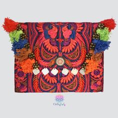 This Colorful Clutch is the ultimate boho-chic accessory. This gorgeous bohemian clutch bag is the perfect accessory to give a unique look to your casual outfits or night out events. Can be also used as an amazing iPad case. Handcrafted by talented artisans using a stunning fabric embroidered by the Hmong hill tribes in Northern Thailand. Details: Material: Embroidered cotton fabric with discreet birds design. Tassel and coins decoration. Magnetic closure with interior zipper pocket Cotton linni Pom Pom Clutch, Colorful Clutch, Handbags For Girls, Bohemian Clutch, Embroidered Clutch Bag, Boho Chic Accessories, Teaching Sewing, Birds Design, Embroidered Clutch