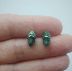 These simple, dainty Emerald stud earrings are so versatile, and will compliment just about any outfit! The genuine carved Emerald stones are hand wrapped with 22 gauge stainless steel wire so they won't tarnish. Earrings will come on an earring card with plastic earring backs. All my jewelry is handmade, and made with patience, care and love. In the unlikely event that it needs to be repaired, I'll do it free of charge. Wire Wrapped Cartilage Earrings As Gift, Minimalist Crystal Earrings As Gift, Modern Green Earrings For May Birthstone, Small Green Earrings For Gift, Minimalist Wire Wrapped Crystal Earrings As Gift, Emerald Earrings For Everyday May Birthstone, Green Hypoallergenic Cartilage Earrings As Gift, Handmade Emerald Earrings For May Birthstone, Tiny Green Earrings For Gift