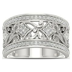 a white gold wedding band with diamonds on top and an intricate design in the middle