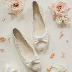 Made from soft ivory lace, finished with a delicate bow and diamante embellishment, step into utter vintage comfort with these graceful wedding ballet flats.

 	100% leather insoles for comfort
 	Soft lace & Diamonte Detail
 	Handmade keepsake box
 	0.5cm flat heel & Anti Slip Sole
 	Available in Ivory
 	Available in sizes UK 2 - 8; EU 35 - 41; US 4 - 10
 	Fits true to size - order your usual size Lace Wedding Boots, House Of Elliot, Ivory Ballet Flats, Bridal Ballet Flats, Flat Wedding Shoes, Classic Black Boots, Wedding Ballet Flats, Lace Ballet Flats, Country Shoes