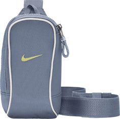 The Nike Sportswear Essentials Crossbody Bag features 2 zippered pockets to let you keep the small stuff organized and easy to grab. The accessory pocket zipper pull offers quick access to smaller items, while an adjustable strap and buckle provide an easy on and off fit. This product is made with at least 50% recycled polyester fibers. Fit & Design: An internal storage compartment makes it easy to store and grab your wallet or phone Adjustable strap provides styling and fit options Dimensions: Small Stuff, Nike Sportswear, Fashion Bags, Adjustable Straps, Crossbody Bag, Buckle, Wallet, Nike, Zipper