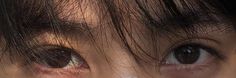 a close up of a person's brown eyes