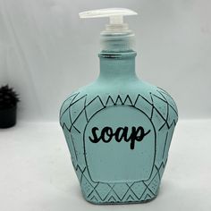 a soap dispenser with the word soap on it