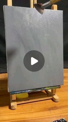 an easel with a video playing on it