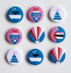 six buttons with different designs on them